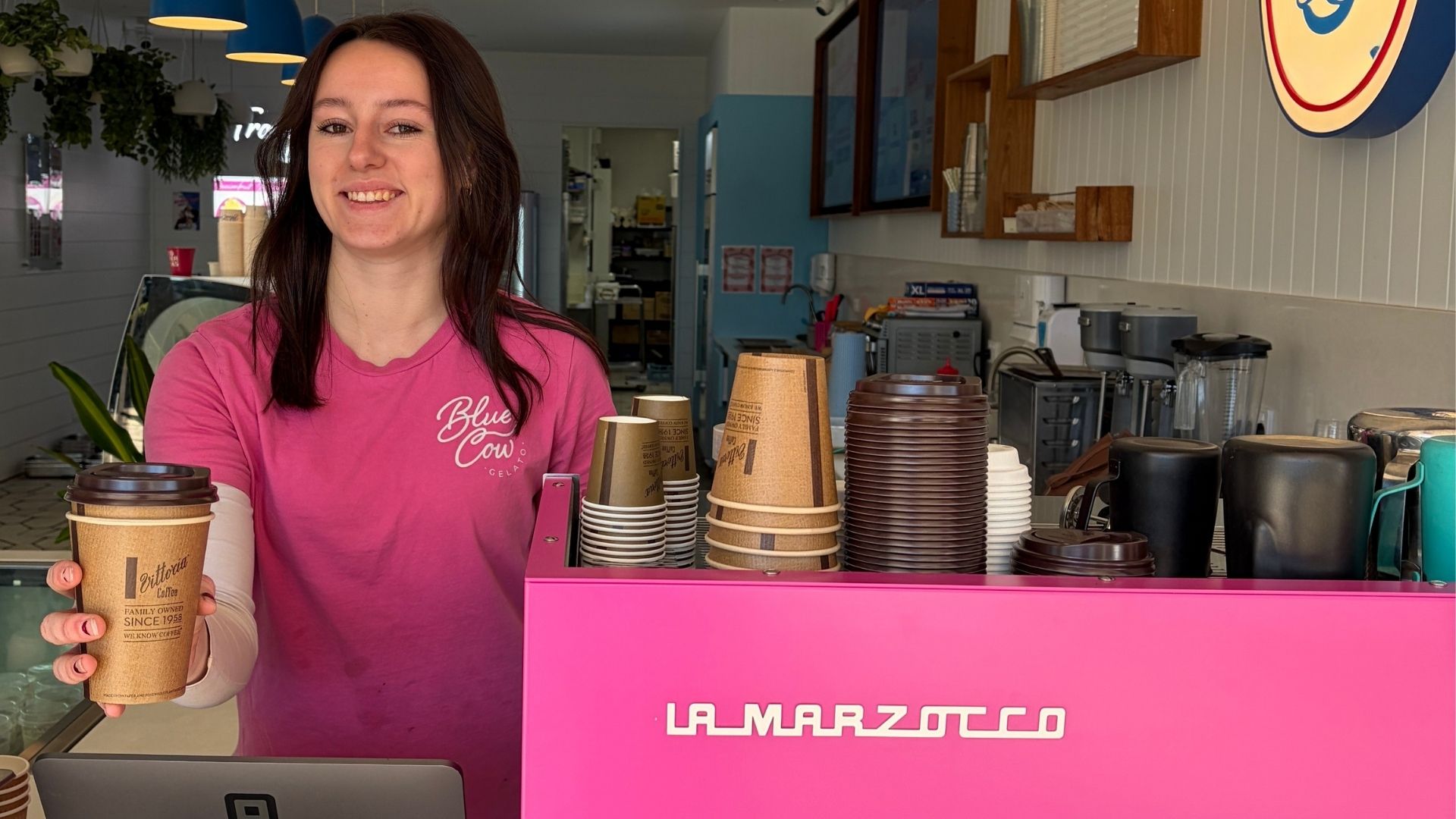 Blue Cow Gelato barista serving fresh coffee at a Port Macquarie coffee shop